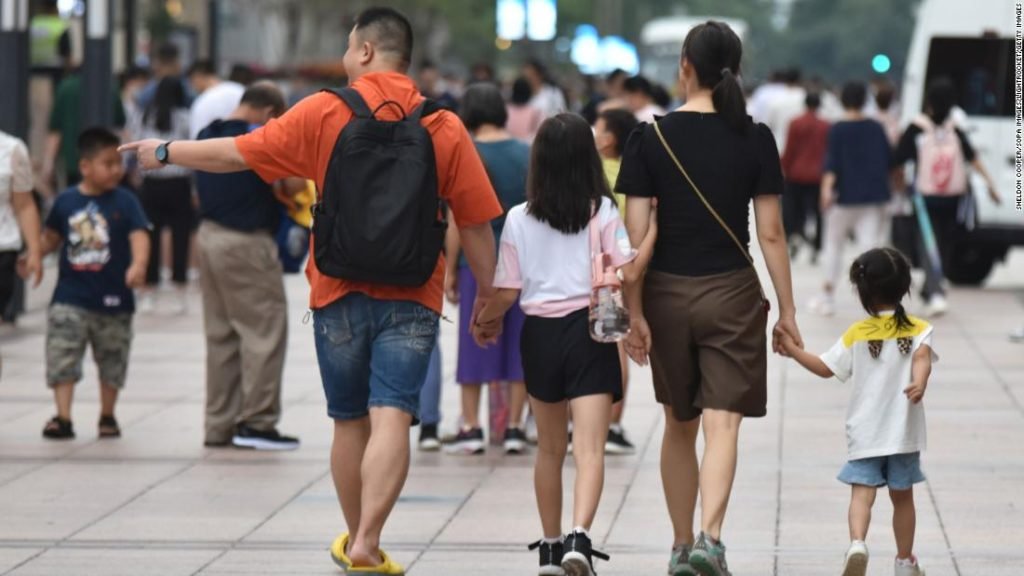BEIJING, CHINA - 2021/07/21: Parents take their children for a walk on Wangfujing Commercial Street in Beijing.
China will establish a comprehensive support system by 2025 that helps to "significantly reduce" burdens on couples related to child-rearing and education in a set of policy tools to boost the number of newborns, the central authorities said on Tuesday. (Photo by Sheldon Cooper/SOPA Images/LightRocket via Getty Images)