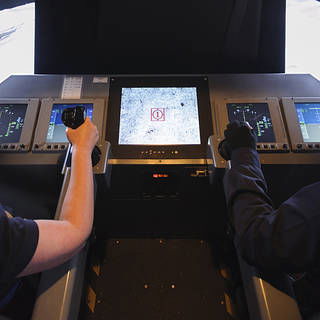 Vertical Motion Simulator (VMS) Lunar Lander configuration with Bonnie Andro-Avila, left standing seat and Sumedha Garud in right standing seat  "flying" the Lunar Lander simulation